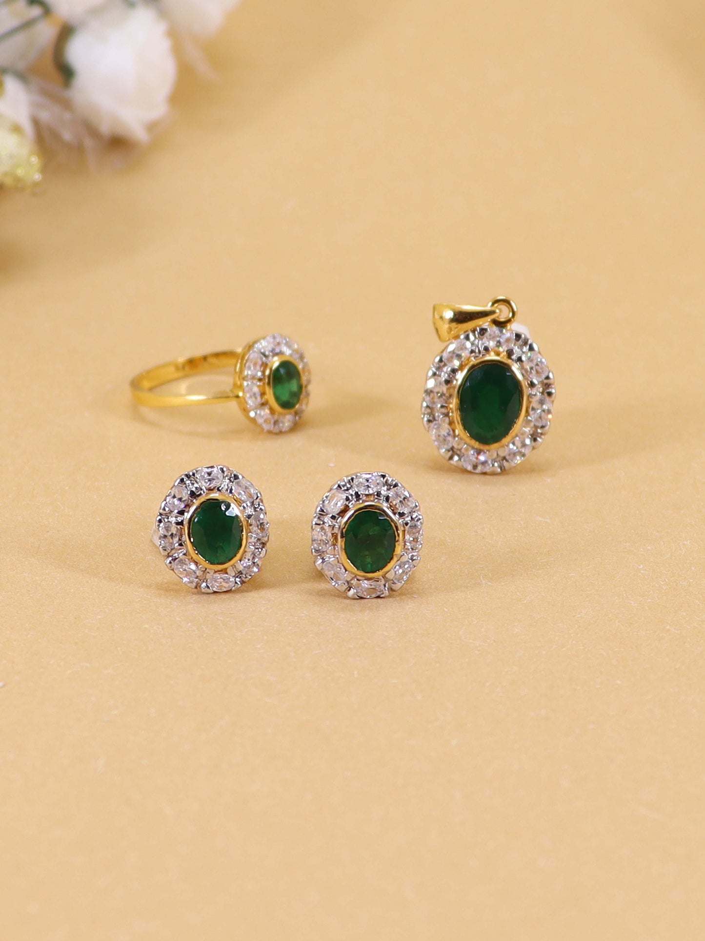 Locket Tops Studded With Zircons And Green Zircons.