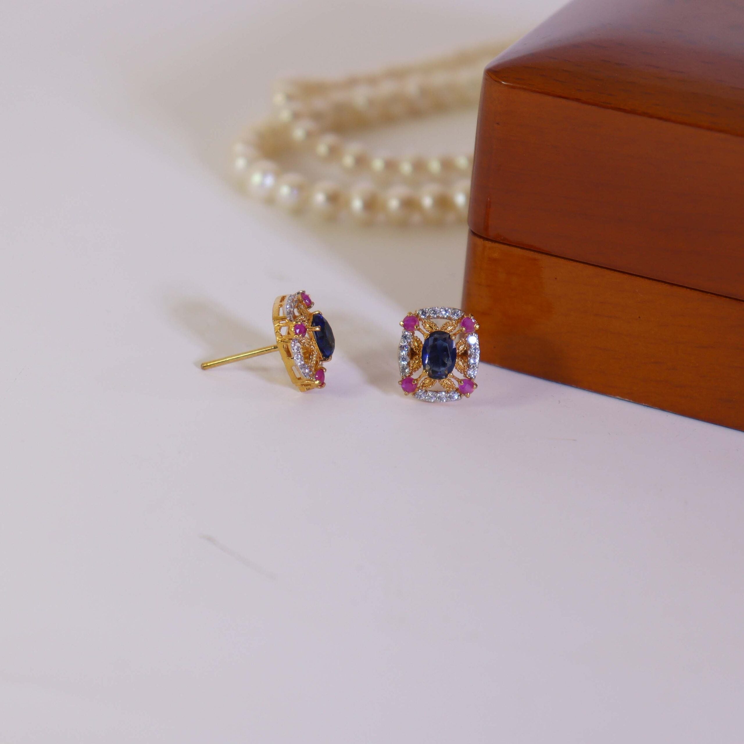 Tops Studded With Blue Zircon And Chatham In 925 Silver.